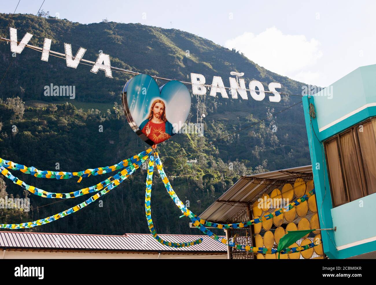 Segno con immagine di Gesù Cristo appeso a Banos, Ecuador Foto Stock