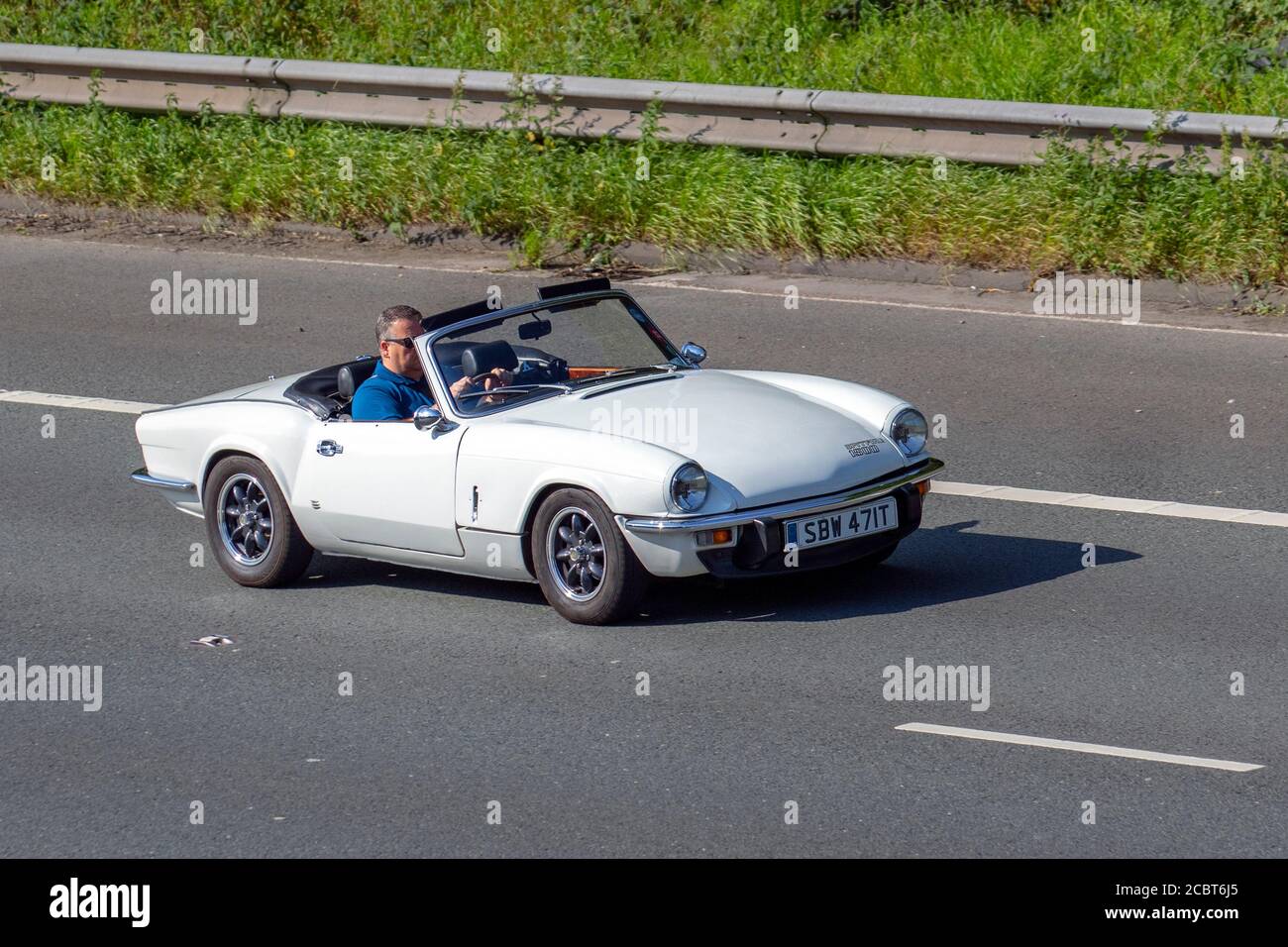 Anni '1978 70 settanta bianco 1500 Triumph Spitfire 1500cc; veicoli in movimento per traffico veicolare, auto che guidano veicoli sulle strade del Regno Unito, motori degli anni '70, motori sulla rete autostradale M6. Foto Stock