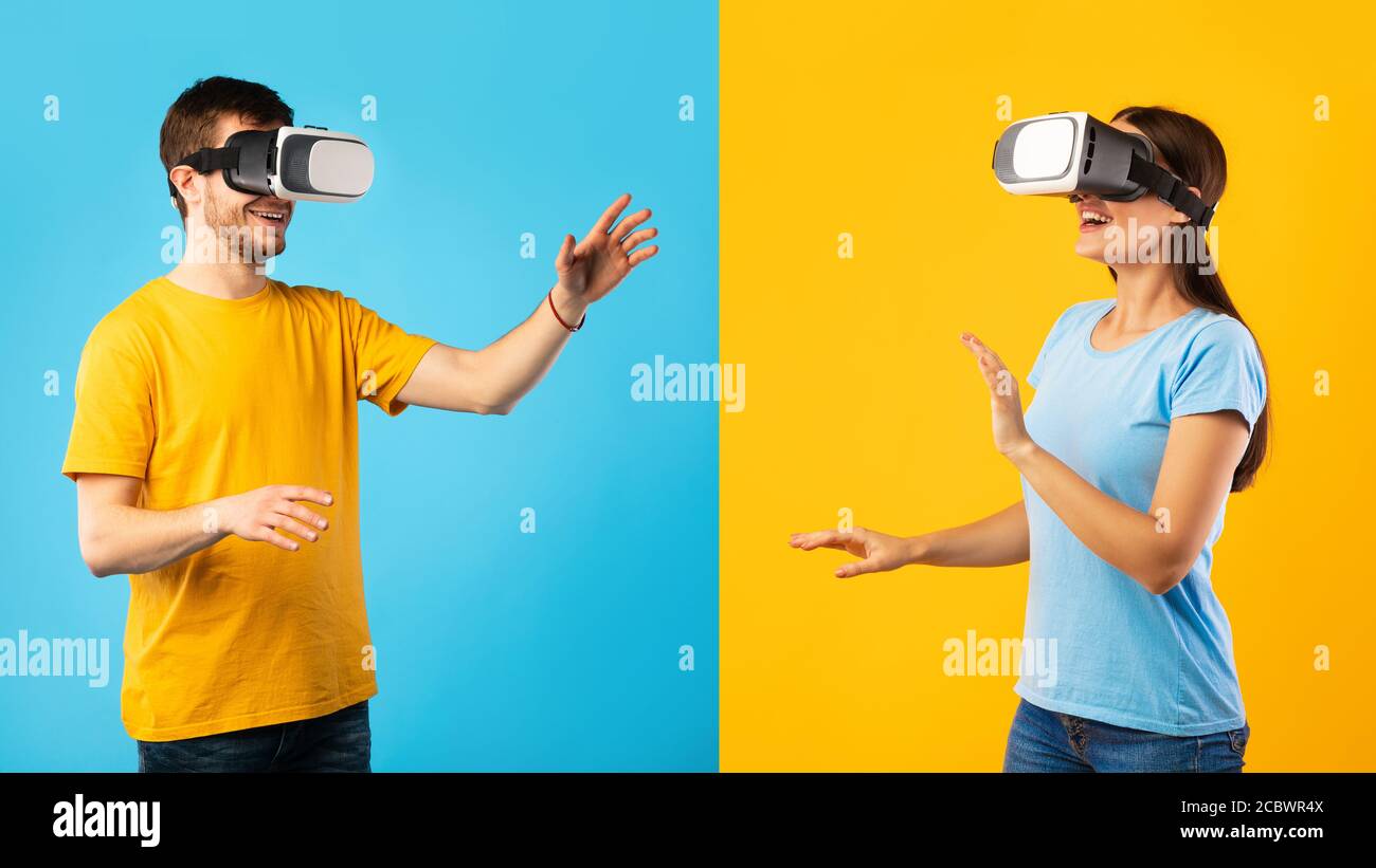 Uomo e donna che indossano occhiali per realtà virtuale in studio Foto Stock
