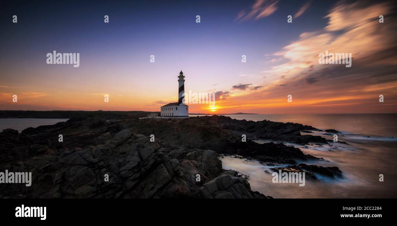 Spagna, Menorca, Favaritx, vista del faro al tramonto Foto Stock