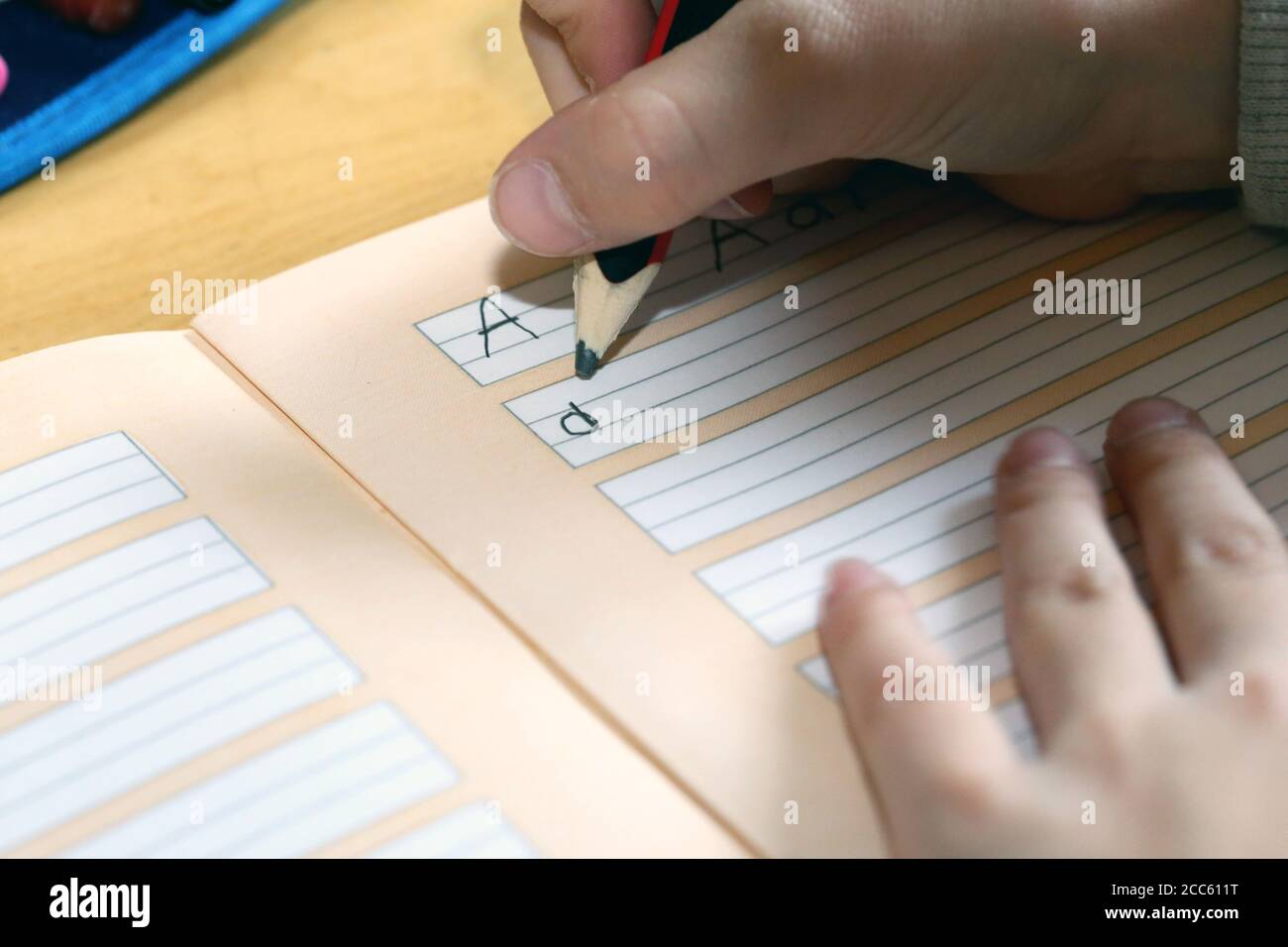 Immagine del simbolo: Il primo livellatore apprende la scrittura Foto Stock