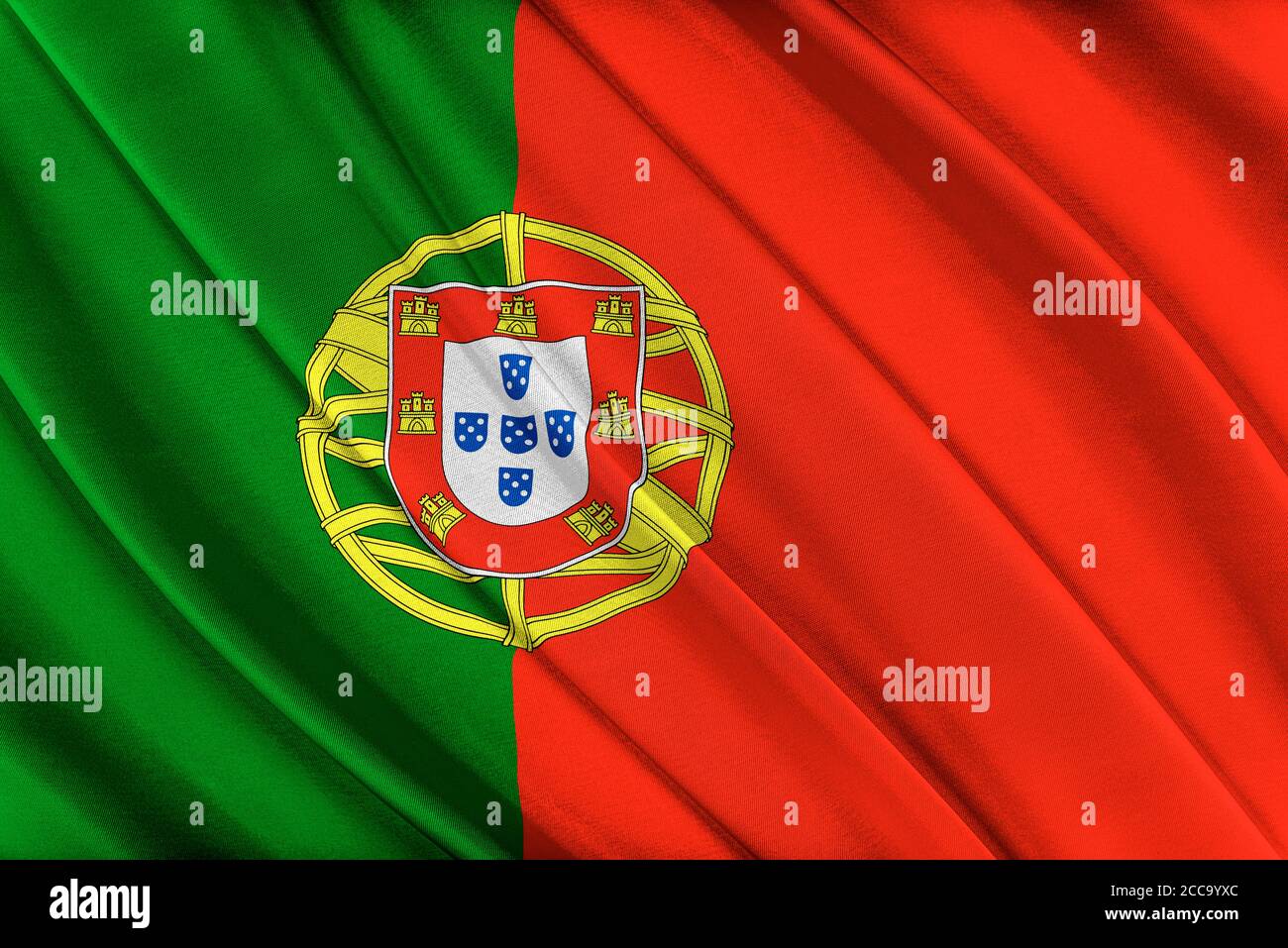 Bandiera colorata portoghese che sventola nel vento. Foto Stock