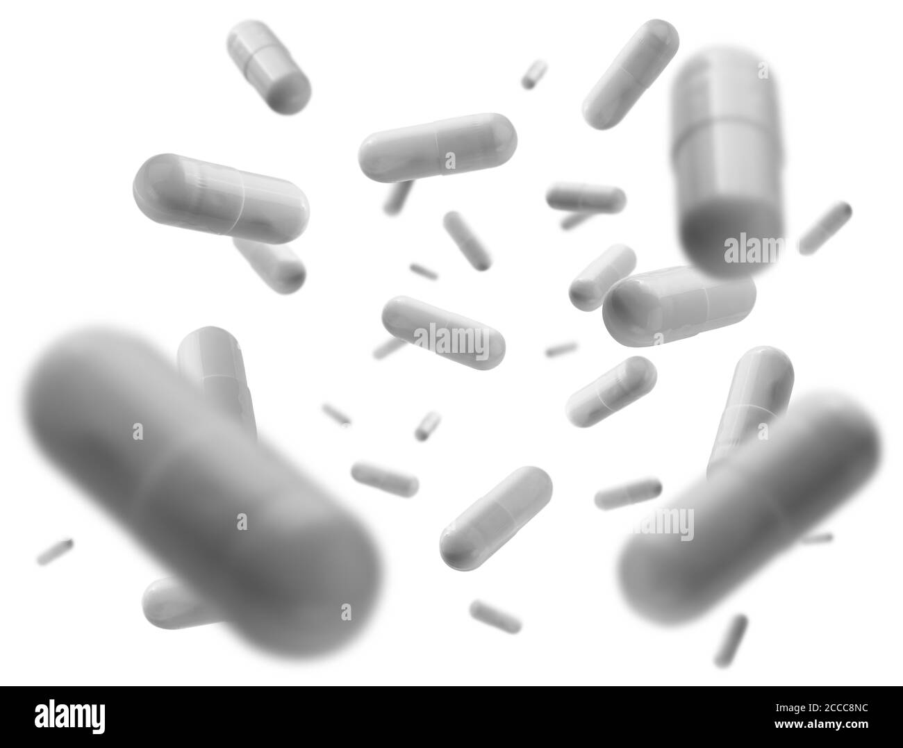 Capsule con il farmaco levitate su sfondo bianco Foto Stock