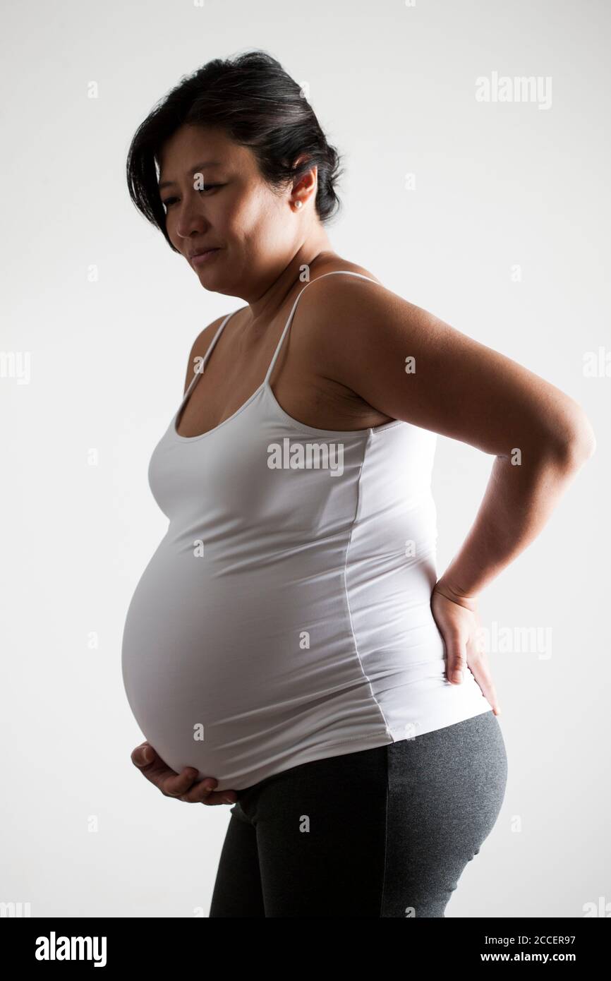 Donna incinta nel dolore Foto Stock