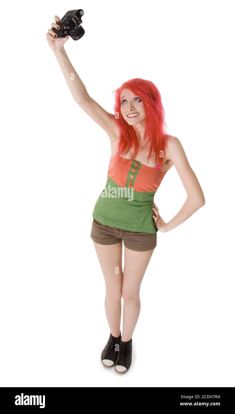 Red-capelli ragazza giovane con fotocamera isolato su bianco Foto Stock