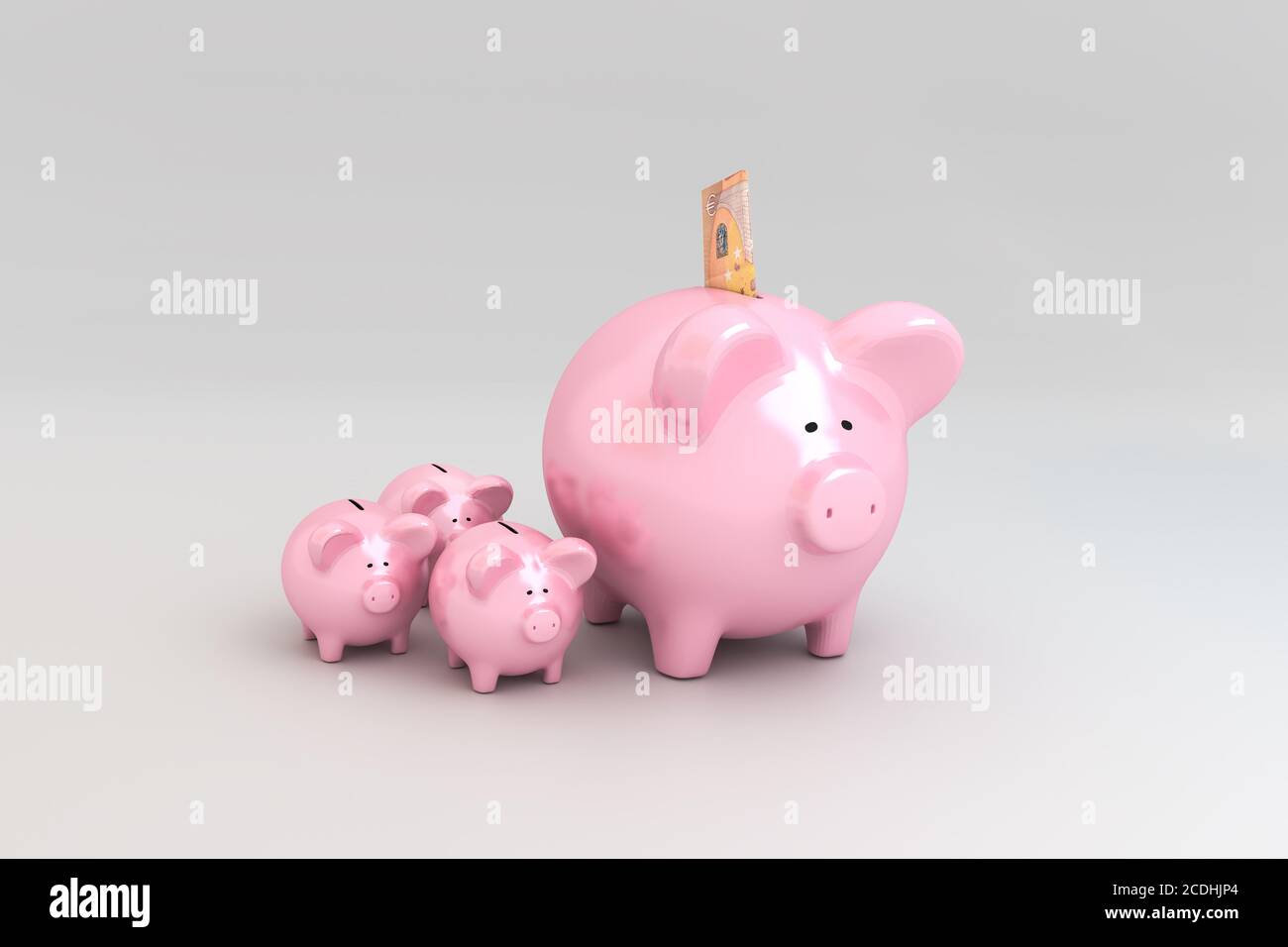 Concetto di Piggy Bank: Ottenere interesse sotto forma di piccole banche piggy. Una banconota da 50 euro ripiegata in apertura. Foto Stock