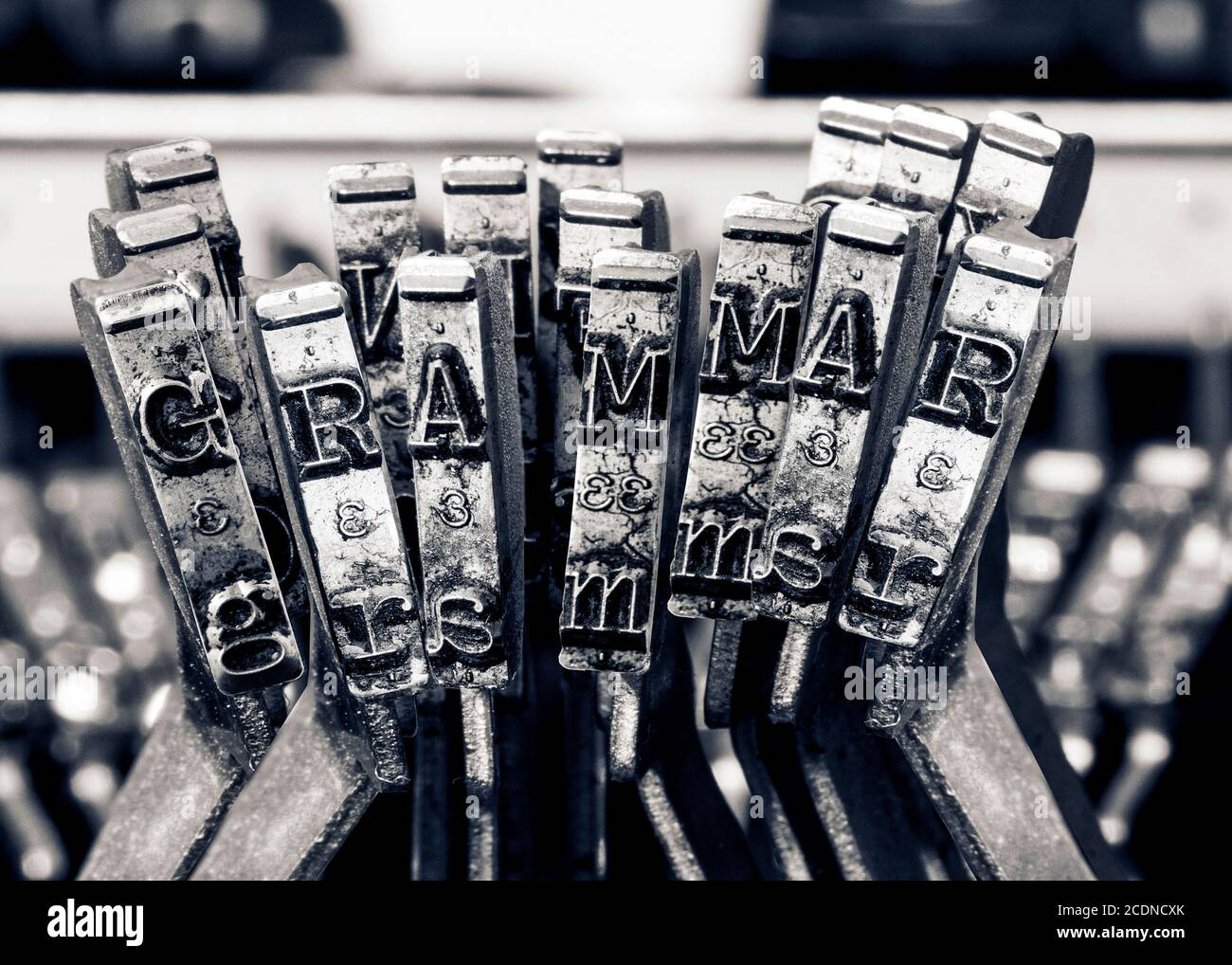 La parola GRAMMER con le vecchie chiavi typwriter monocromatico Foto Stock