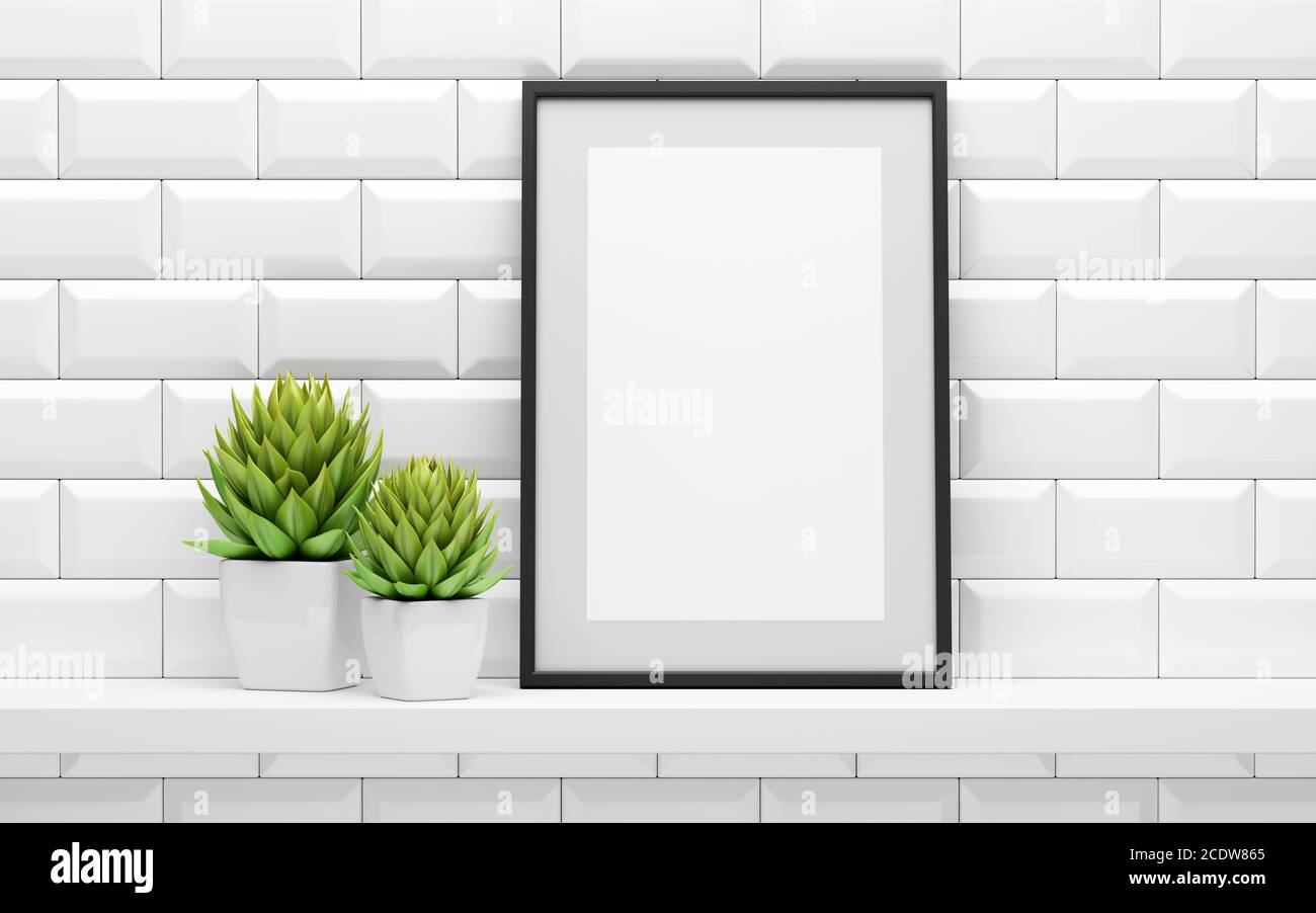 cornice nera mock up e piante in vaso verde su ripiano bianco Foto Stock
