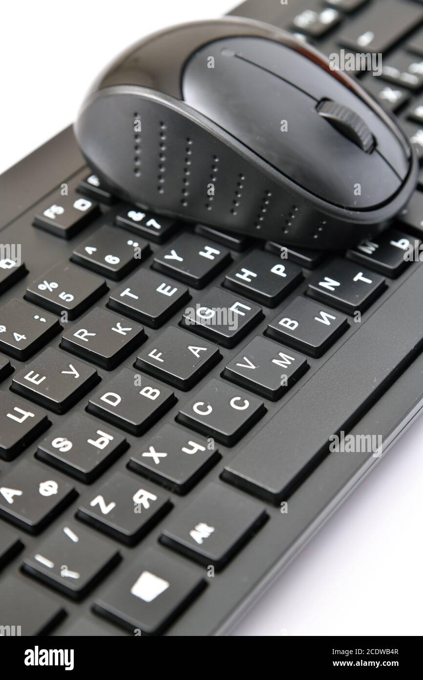 Mouse e tastiera wireless con lettere in russo e inglese Foto Stock