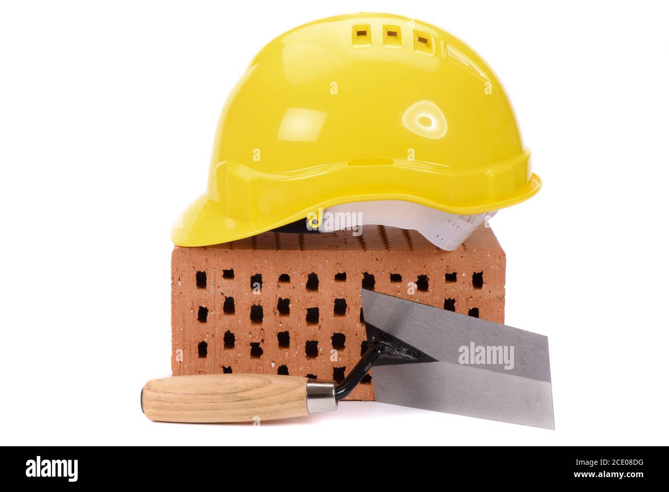 Strumenti e mattone come simbolo per la costruzione della casa Foto Stock