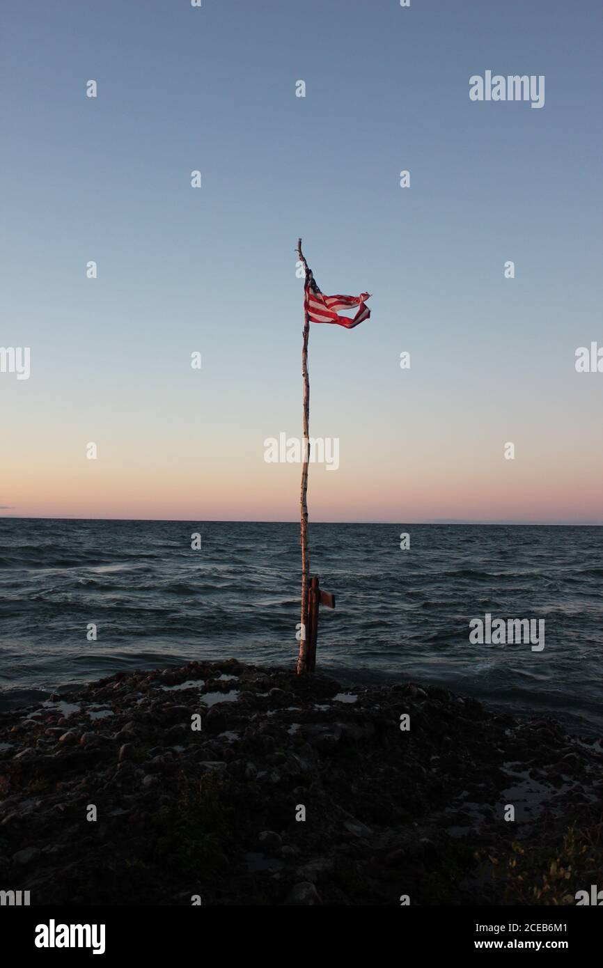 Tramonto con bandiera in Michigan SU Foto Stock