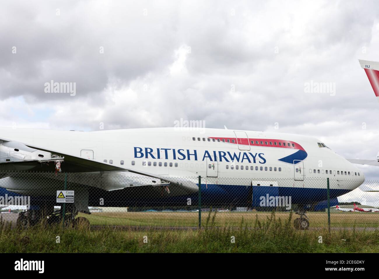 Decommissionato, British Airways, Boeing 747, aereo dietro recinzione, ritiro dell'iconico Boeing 747 jumbo jet Foto Stock