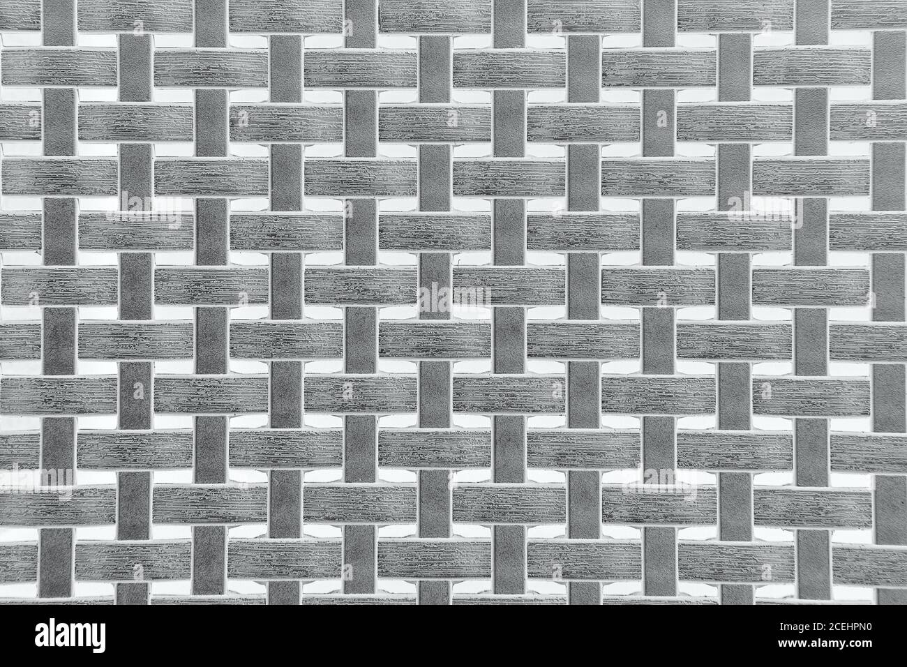 Tessuto in tessuto di vimini in plastica, motivo sfondo grigio con intemperie Foto Stock