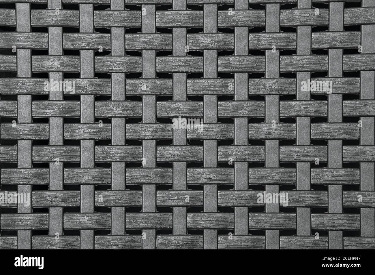 Tessuto di vimini in plastica grigia, motivo sfondo marrone con intemperie Foto Stock