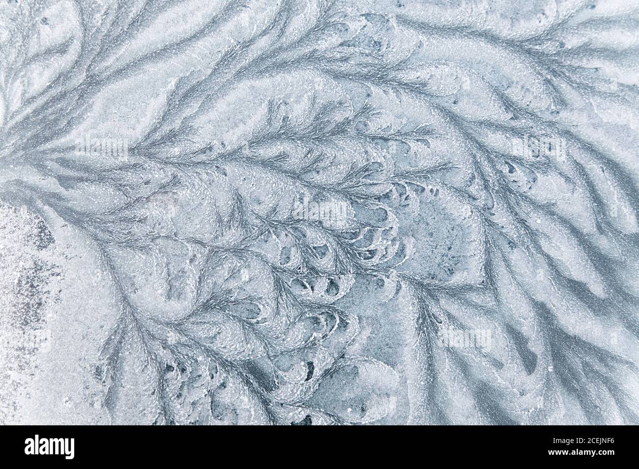 texture di ghiaccio astratte su una vetrina di auto in inverno Foto Stock