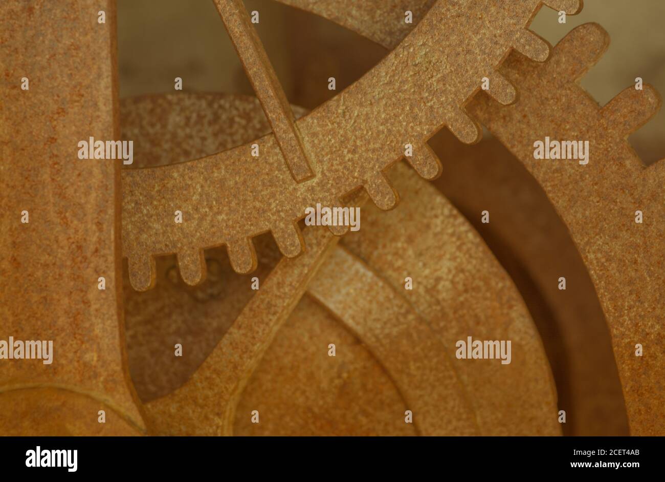 Sfondo indistinto con una parte di un vecchio ingranaggio Foto Stock