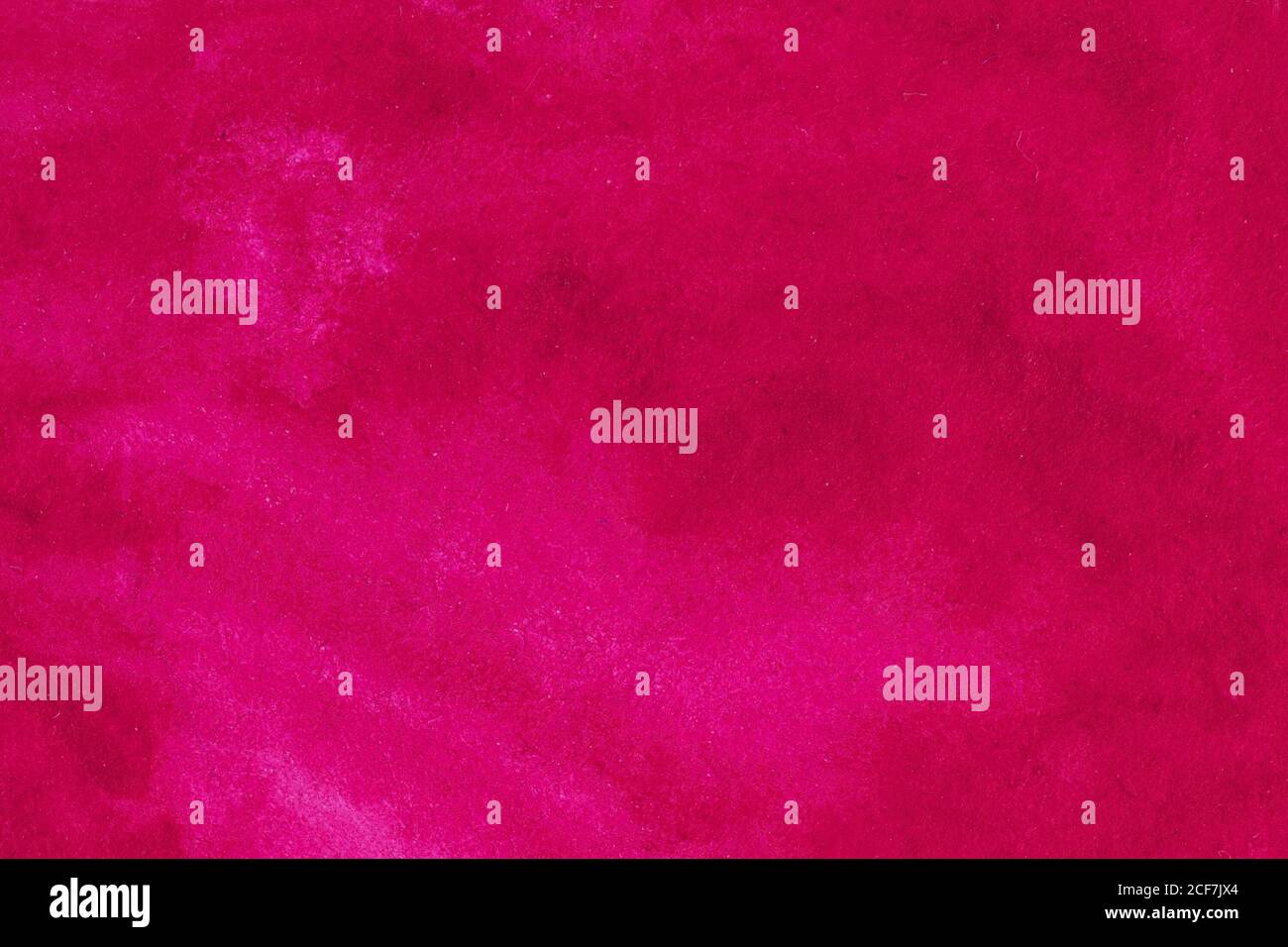 Colore rosso rubino sbavato su fondo carta testurizzato Foto Stock