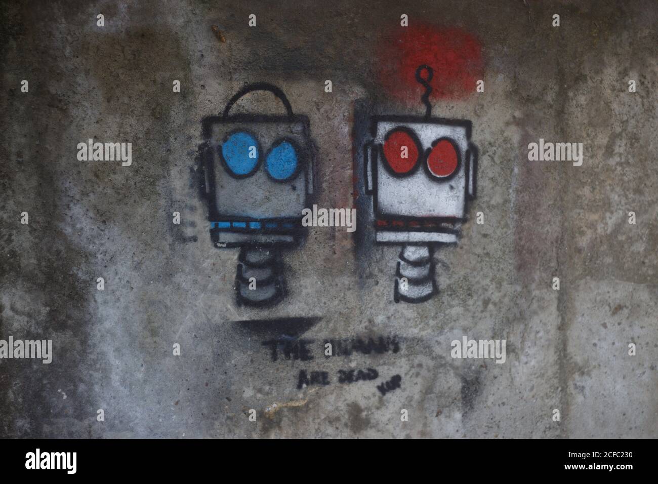Robot Graffiti su parete in cemento Foto Stock