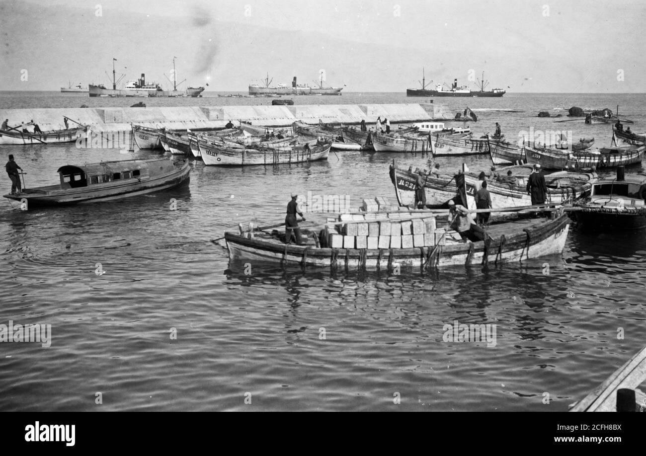Didascalia originale: Cultura arancione di Jaffa. Barca a vela caricata con arance - Ubicazione: CA. 1900 Foto Stock