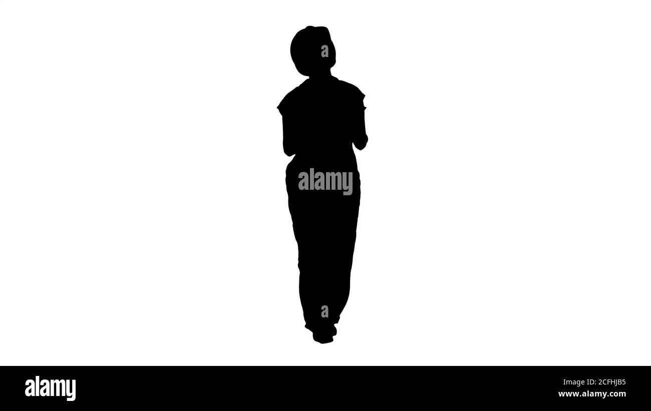 Silhouette Donna operaio di costruzione con il controllo del tablet sito di costruzione. Foto Stock