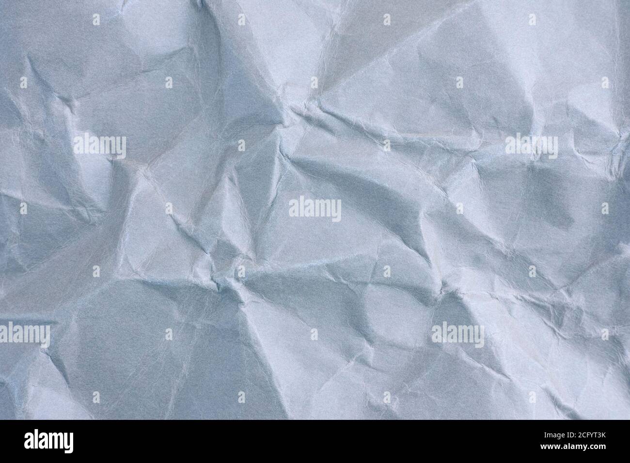 Sfondo di carta stropicciata blu chiaro. Primo piano. Foto Stock