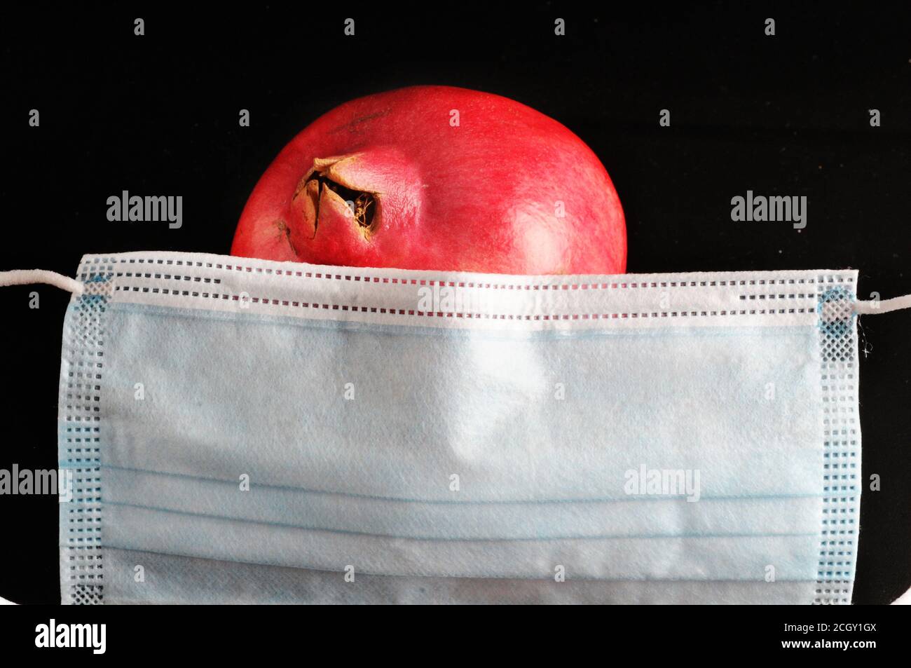 Corona Rosh hashana - concetto - maschera con melograno Foto Stock