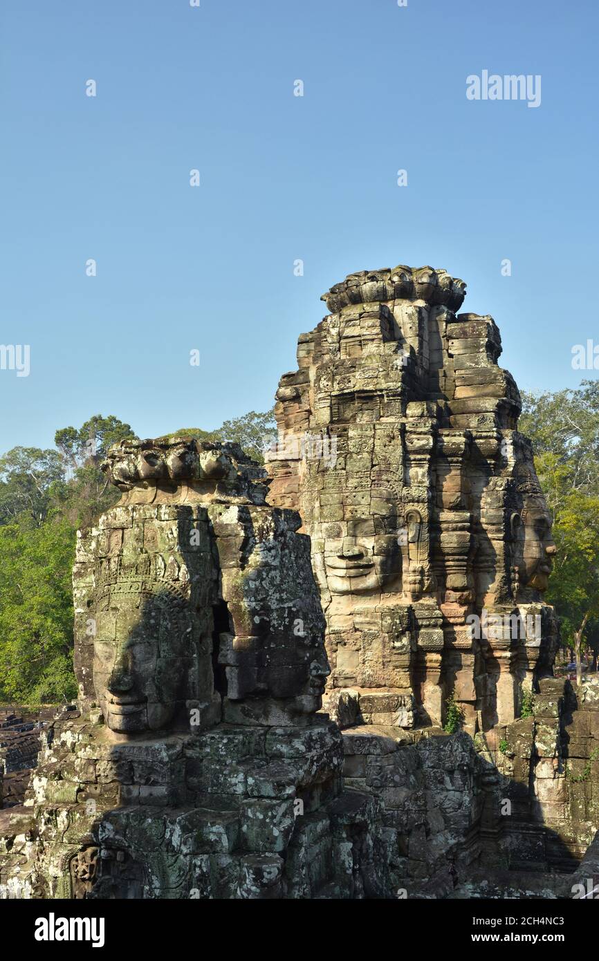 Facce di pietra nel Tempio Bayon, Angkor Thom, Cambogia Foto Stock