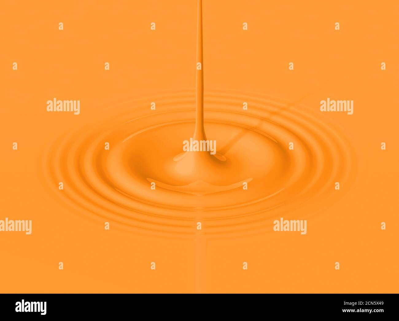 Goccia di frullato arancione e ondulazione Foto Stock