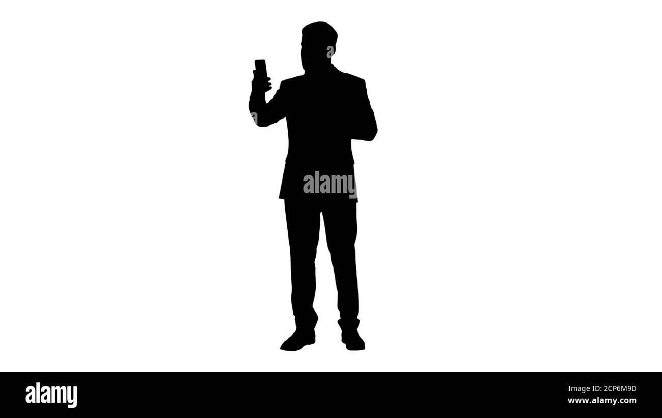 Bell'uomo d'affari turk che fa una videochiamata con il suo smartphon Foto Stock