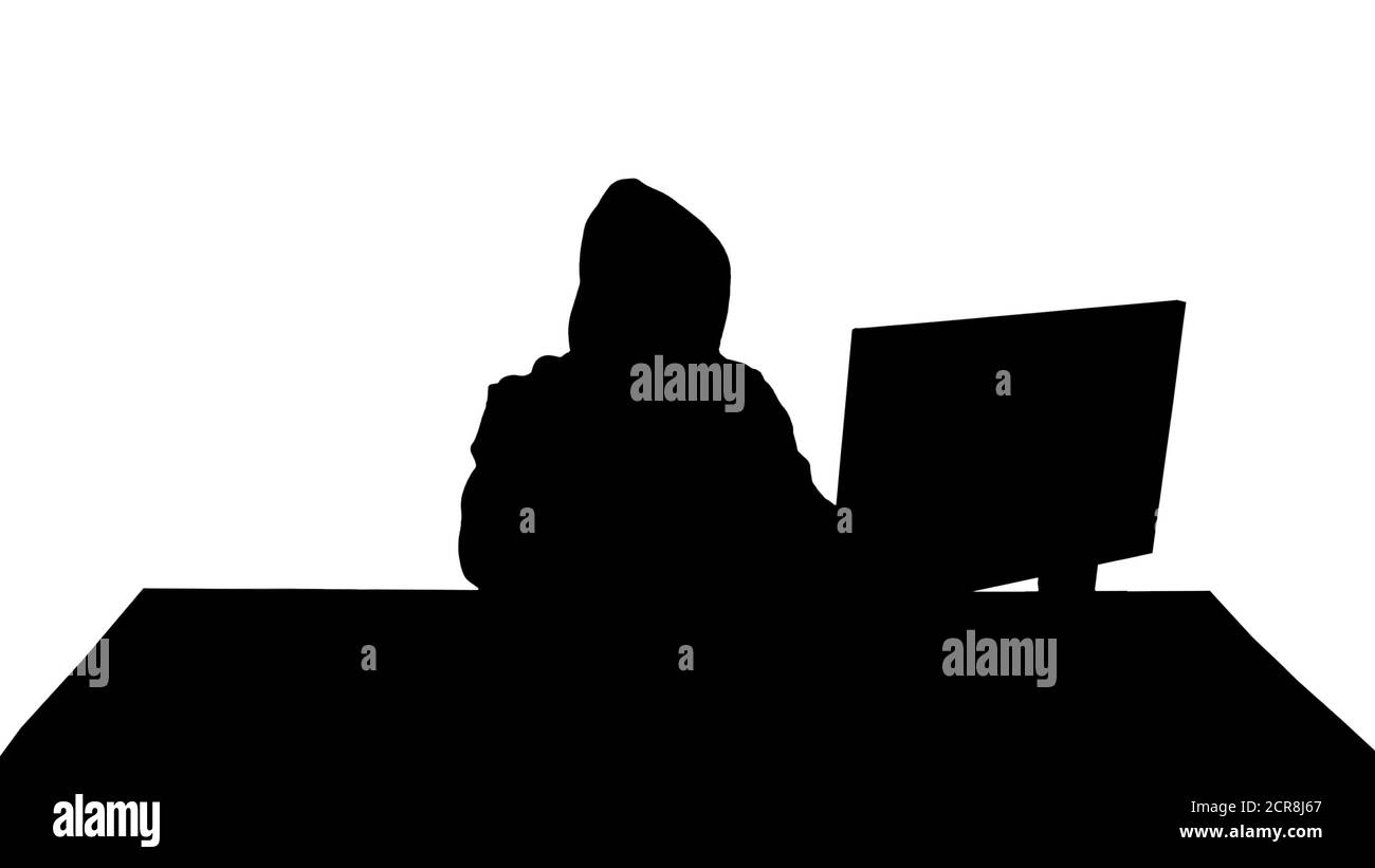 Silhouette hacker esperto risponde a una chiamata. Foto Stock