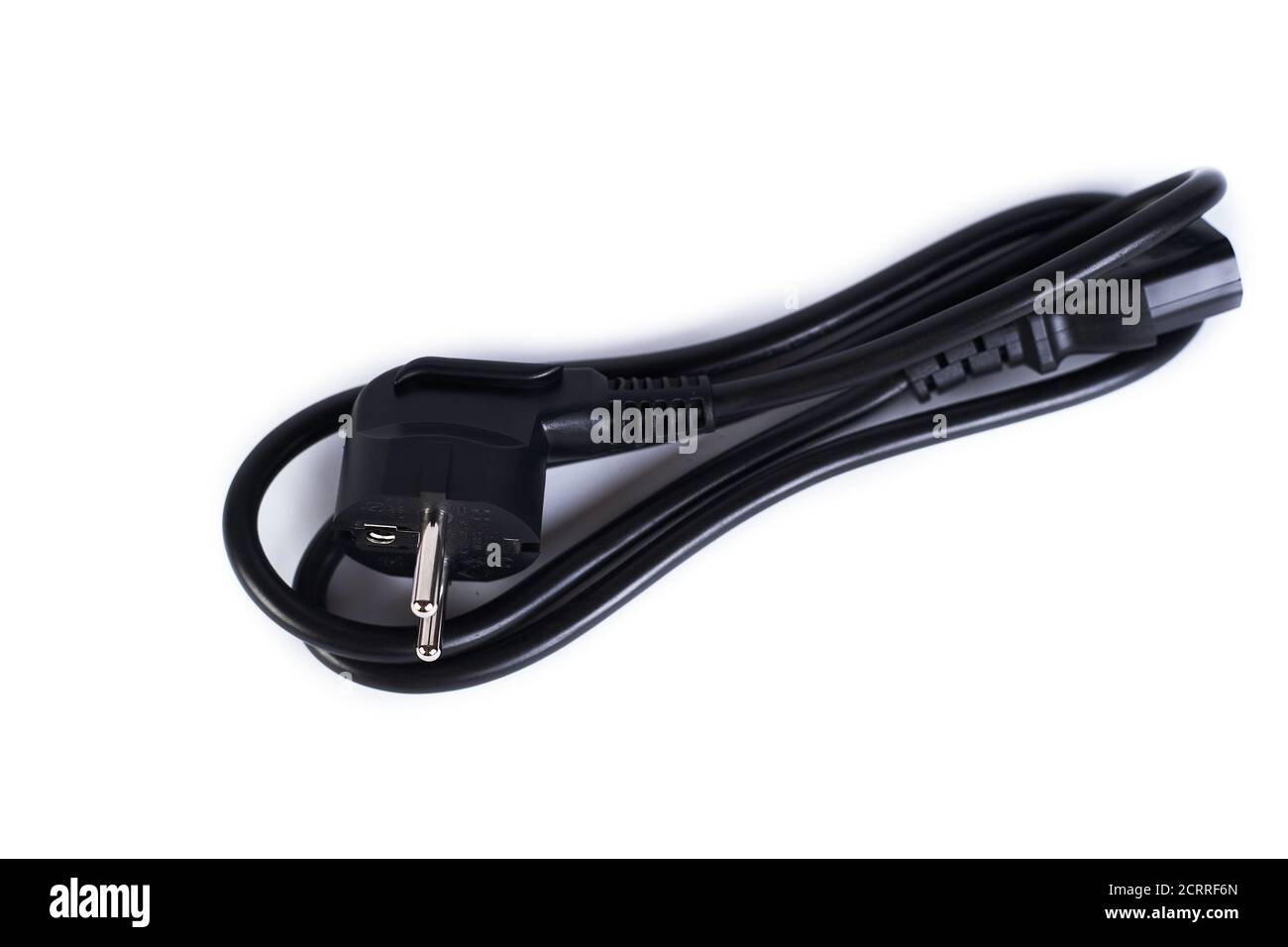 Cavo di alimentazione nero isolato su sfondo bianco. Cavo di alimentazione standard a 3 pin per computer, monitor, elettrodomestici. Foto Stock