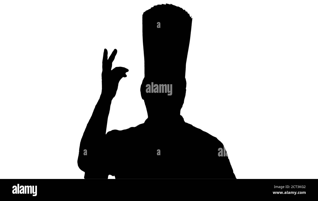 Silhouette Chef maschio che fa un vero e proprio gesto di marmellata alla macchina fotografica. Foto Stock