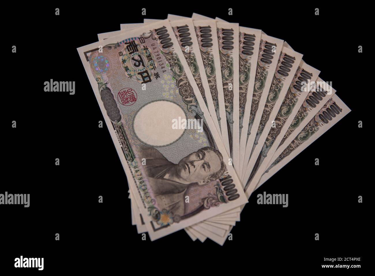 Valuta giapponese 100,000 yen su sfondo nero Foto Stock