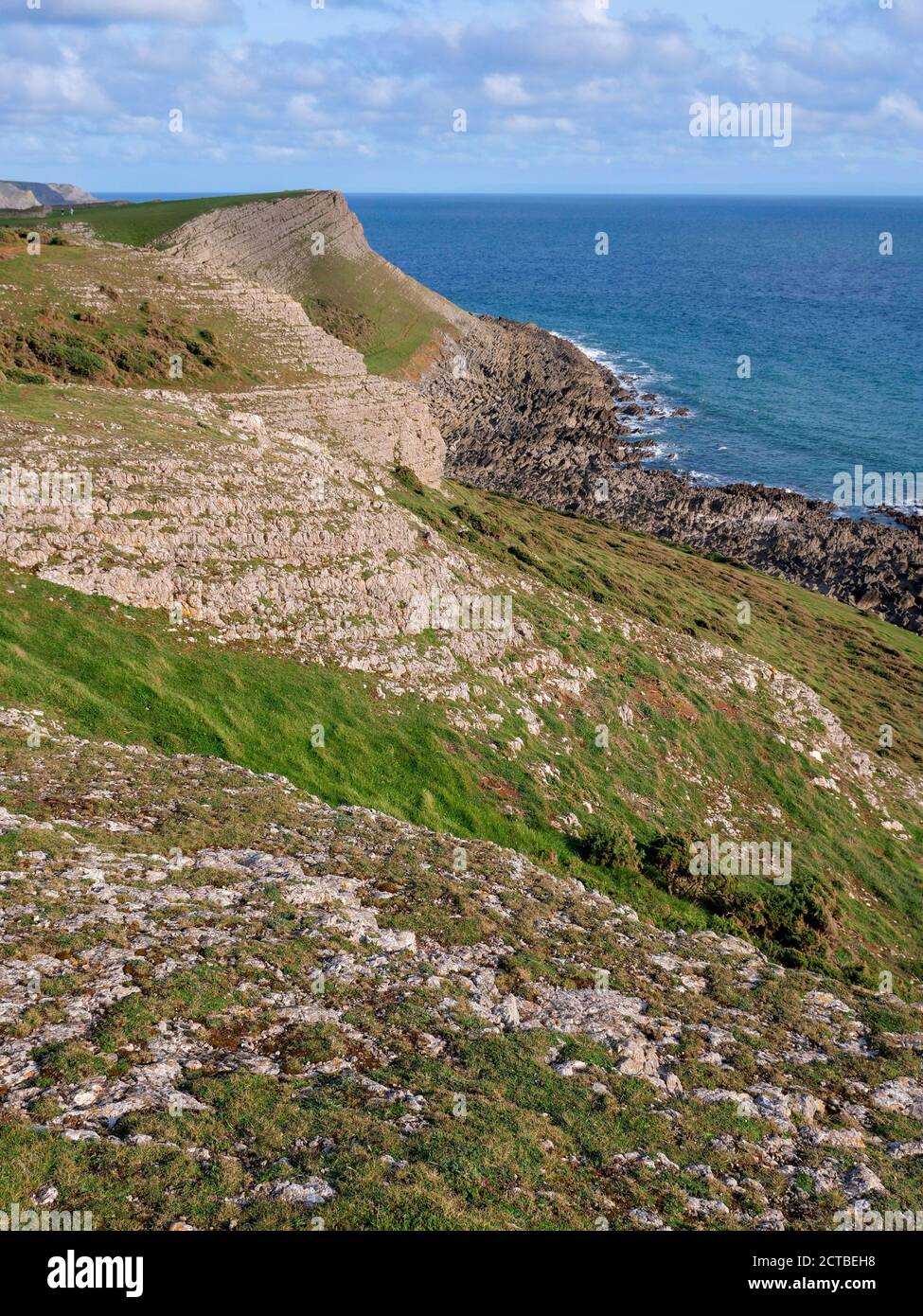 La vecchia Rectory una casa isolata nel paesaggio e. spiaggia di Rhossili Beach sulla penisola di Gower Galles UK Foto Stock