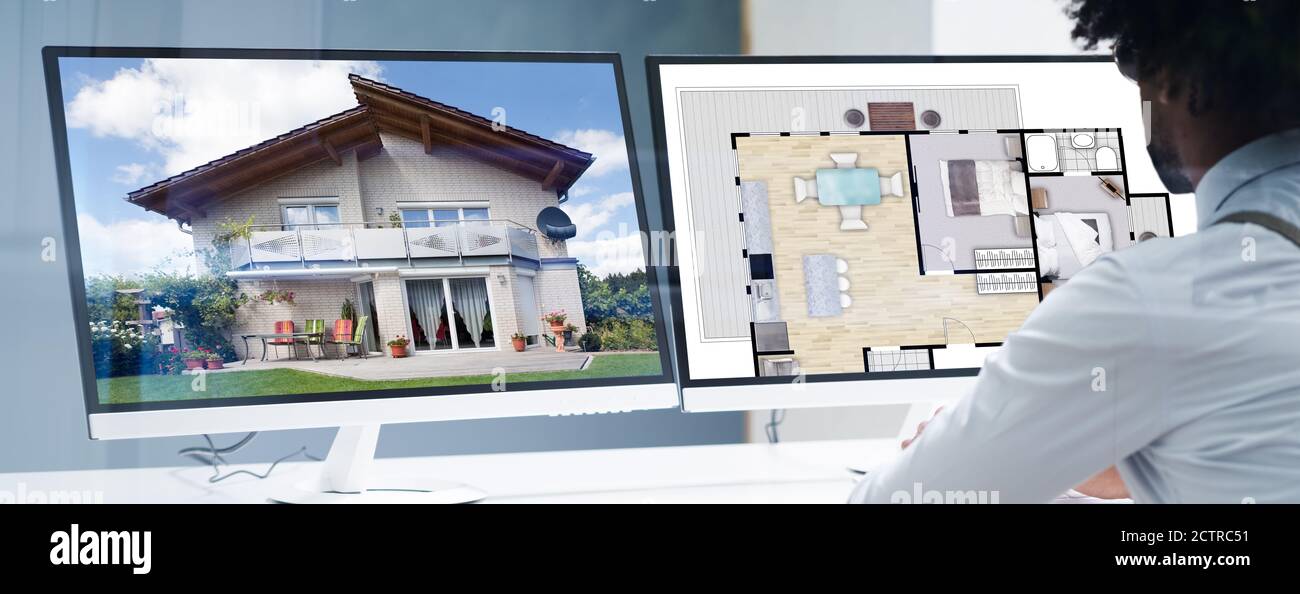 L'uomo dell'assessore domestico afroamericano usando il calcolatore Foto Stock