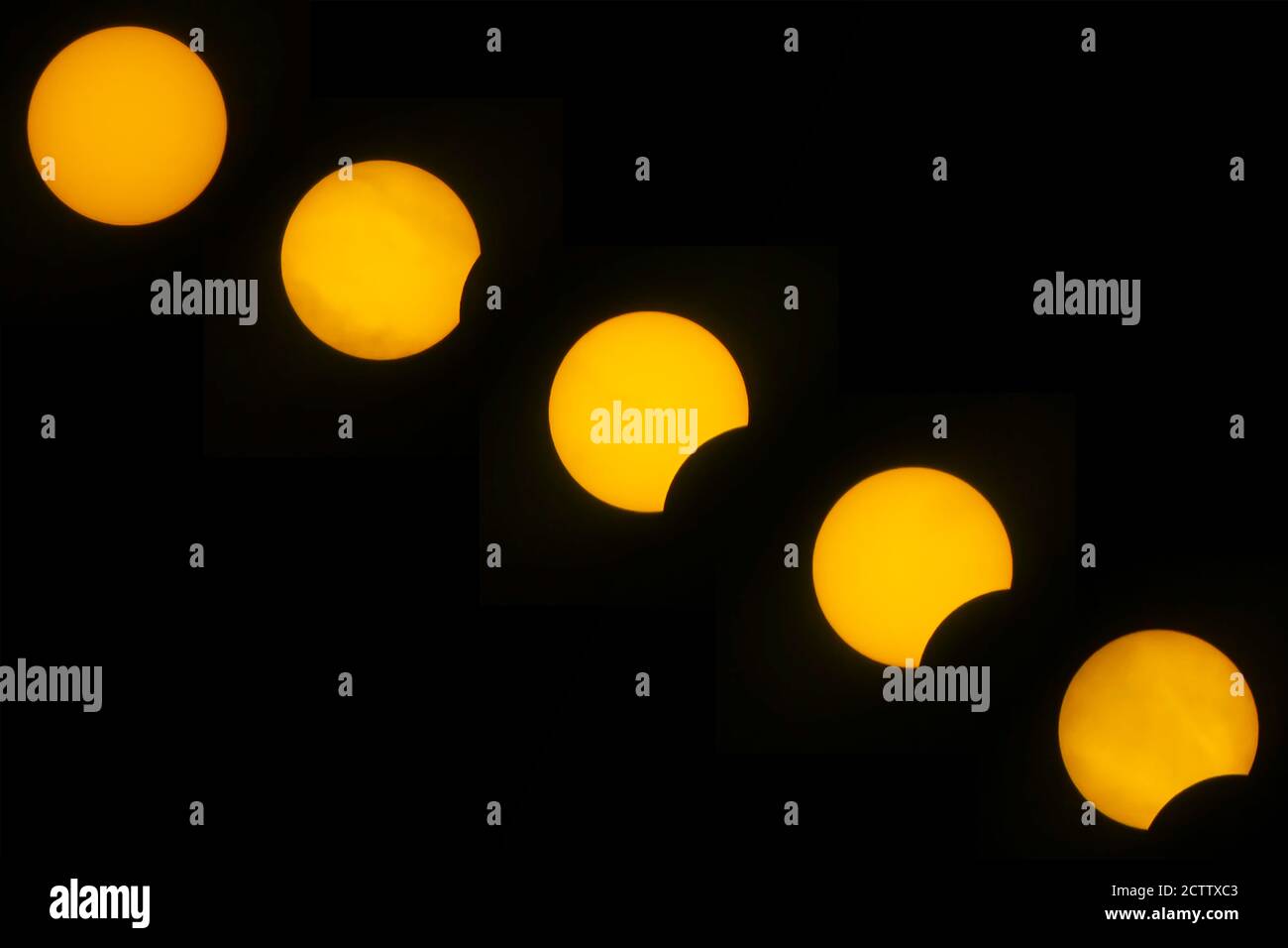 Sequenza DI un Eclipse solare parziale Foto Stock