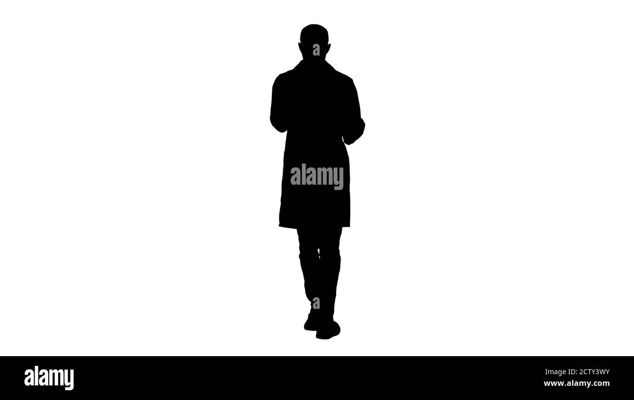 Silhouette Doctor esame di una radiografia polmonare durante la camminata. Foto Stock Silhouette Doctor esame di una radiografia polmonare durante la camminata. Foto Stock