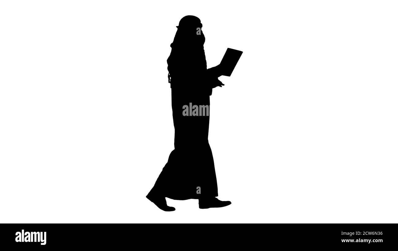 Sheikh utilizzando tablet digitale e camminare, Alpha Channel Foto Stock
