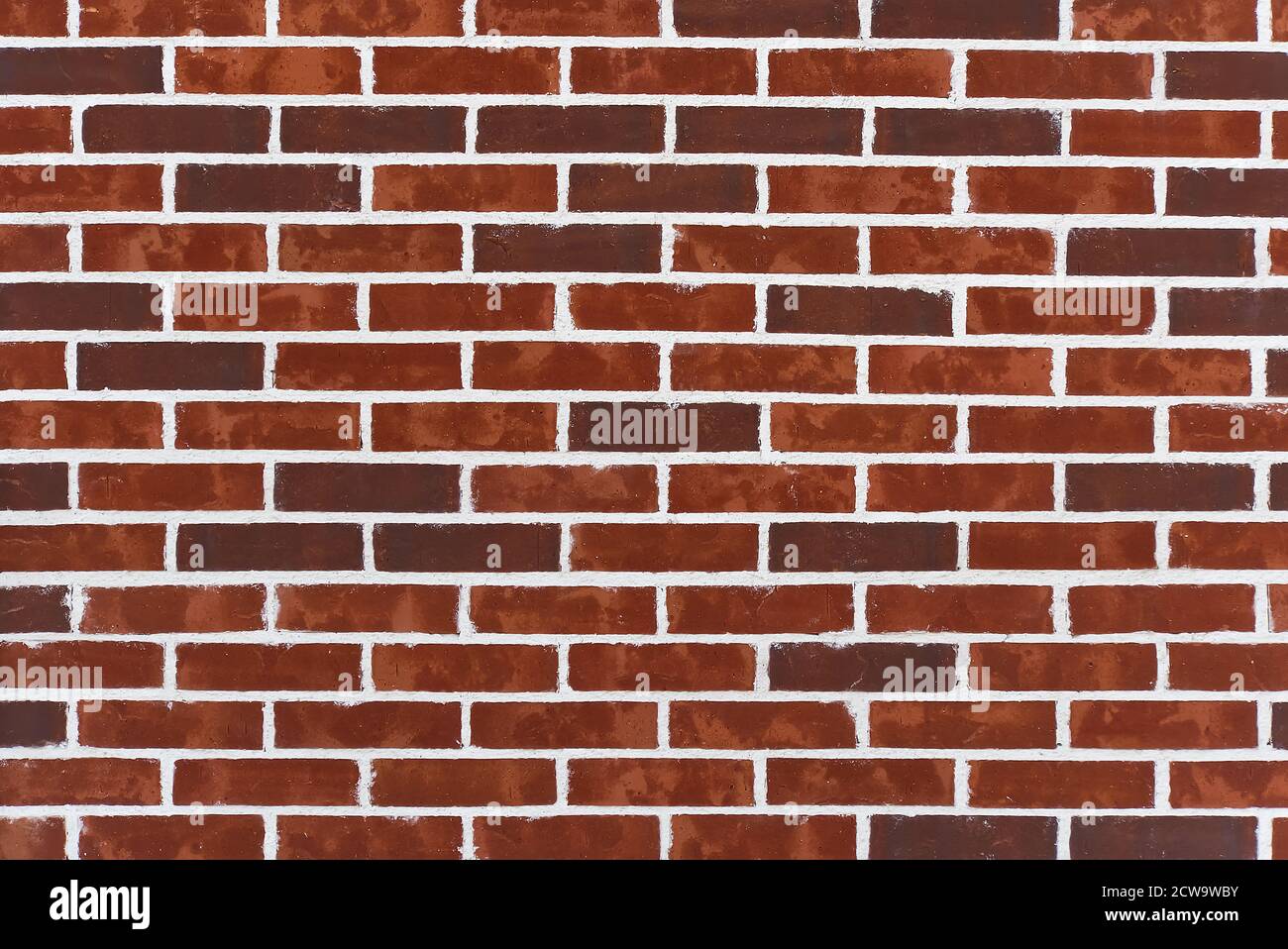 Trama di sfondo di vecchi mattoni vittoriani e mortaio. Muro di mattoni rossi scuri con cucitura bianca. Nuovo sfondo di texture muratura mattone. Foto Stock