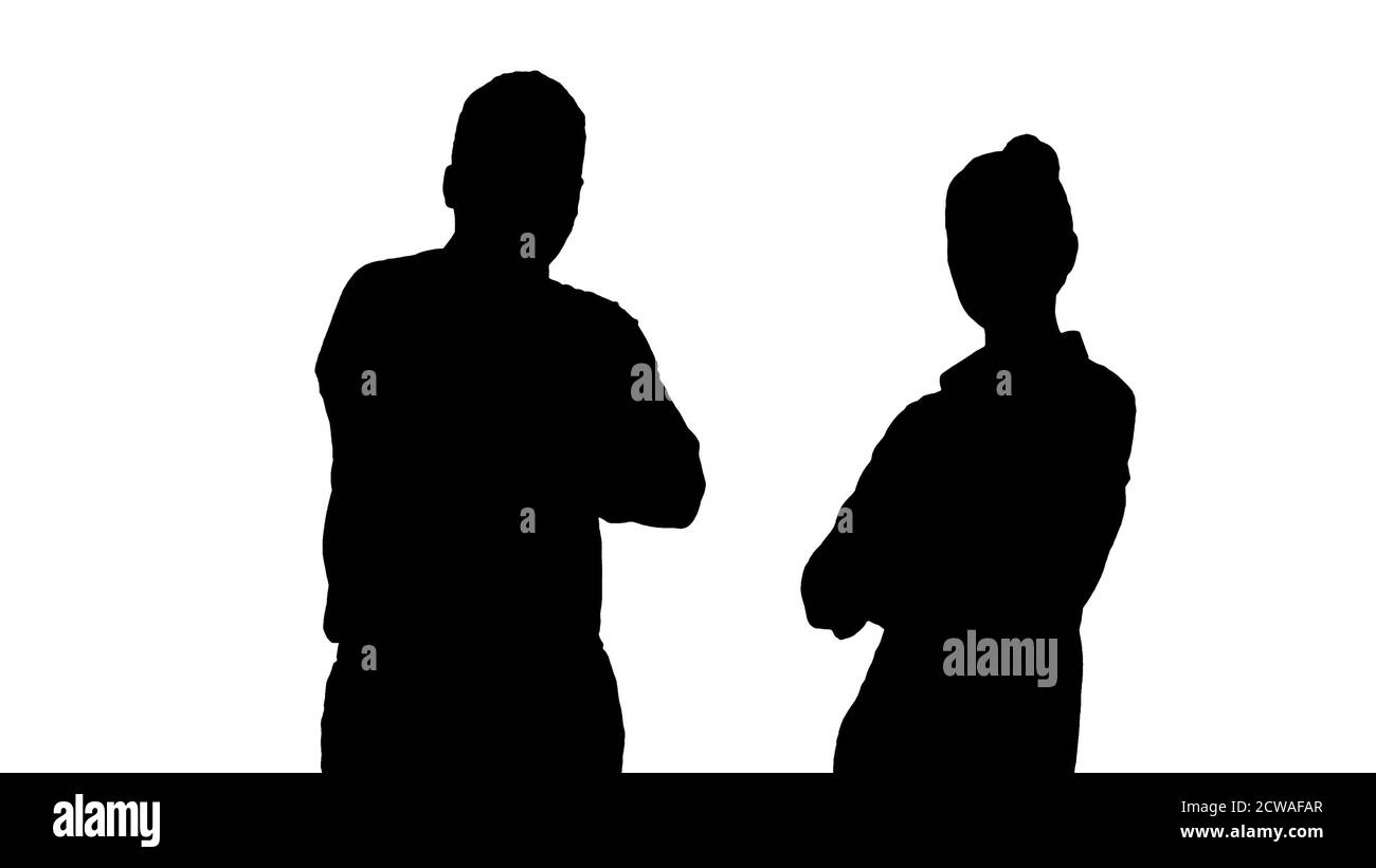 Silhouette International uomini d'affari in piedi con ar ripiegato Foto Stock