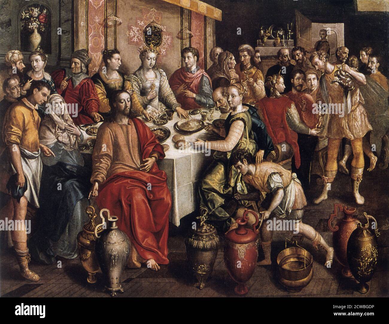 Il matrimonio a Cana' di Martin de Vos, 1596-1597. Il dipinto mostra il primo miracolo di Cristo. Quando il vino si esaurì in un matrimonio in cui Gesù e sua madre erano ospiti, cambiò l'acqua nel vino più raffinato, un tema perfetto per l'altare dei Tavern-Keepers nella Cattedrale di Anversa. Gesù e sua madre si distinguono per i loro semplici abiti 'biblici'. Gli ospiti sono sicuri di includere diversi membri senior della Tavern-Keepers' Guild. Dalla collezione del Vrouwekathedraal, Anversa, Belgio. Foto Stock