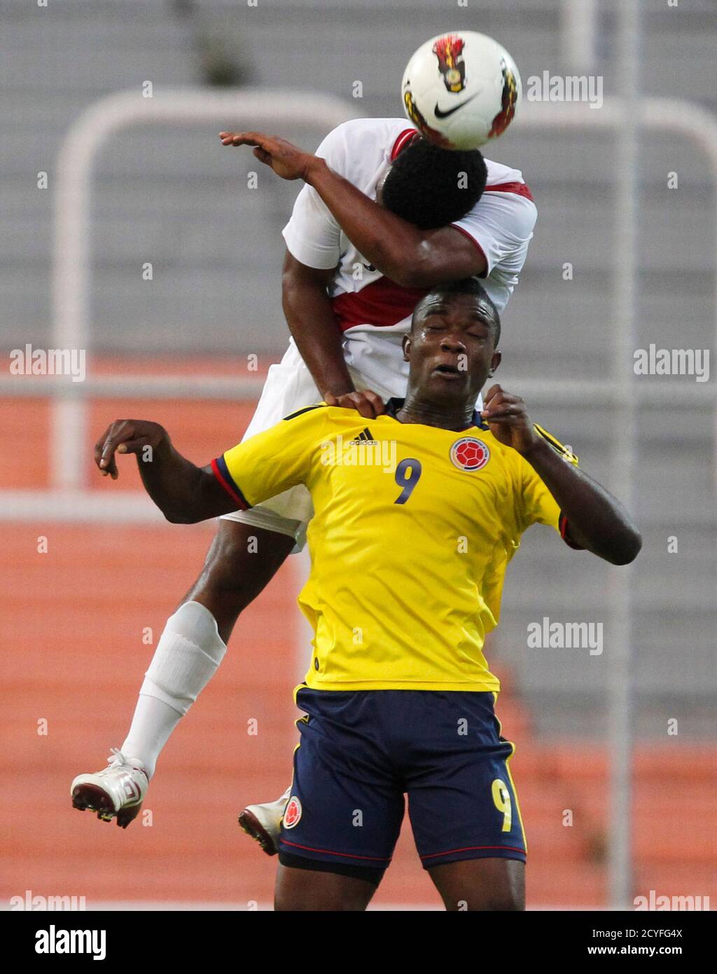 Peru S Marcos Ortiz Heads The Ball Over Colombia S John Andres Cordoba Front During Their South American Under Championship Soccer Match In Mendoza January 27 13 The Top Four Teams Qualify For The