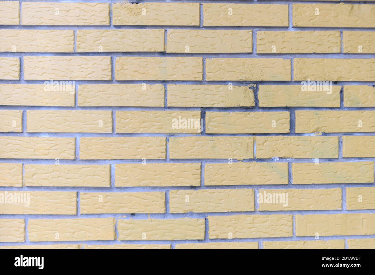 Giallo grunge muro di mattoni sfondo Foto Stock