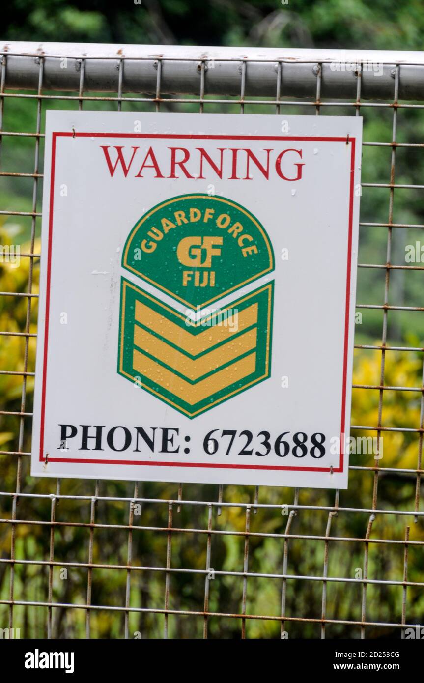 Cartello di avvertenza recinzione sorvegliata di sicurezza nelle Fiji Foto Stock