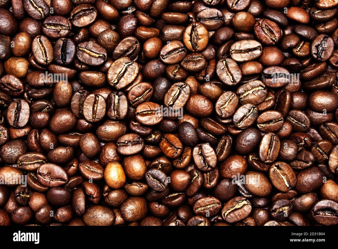 Chicchi di caffè arrosto come sfondo, primo piano. Foto Stock