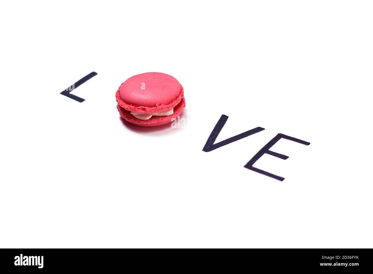 Amore. Macaroon e scritte a mano. Concetto di amore dolce. Foto Stock