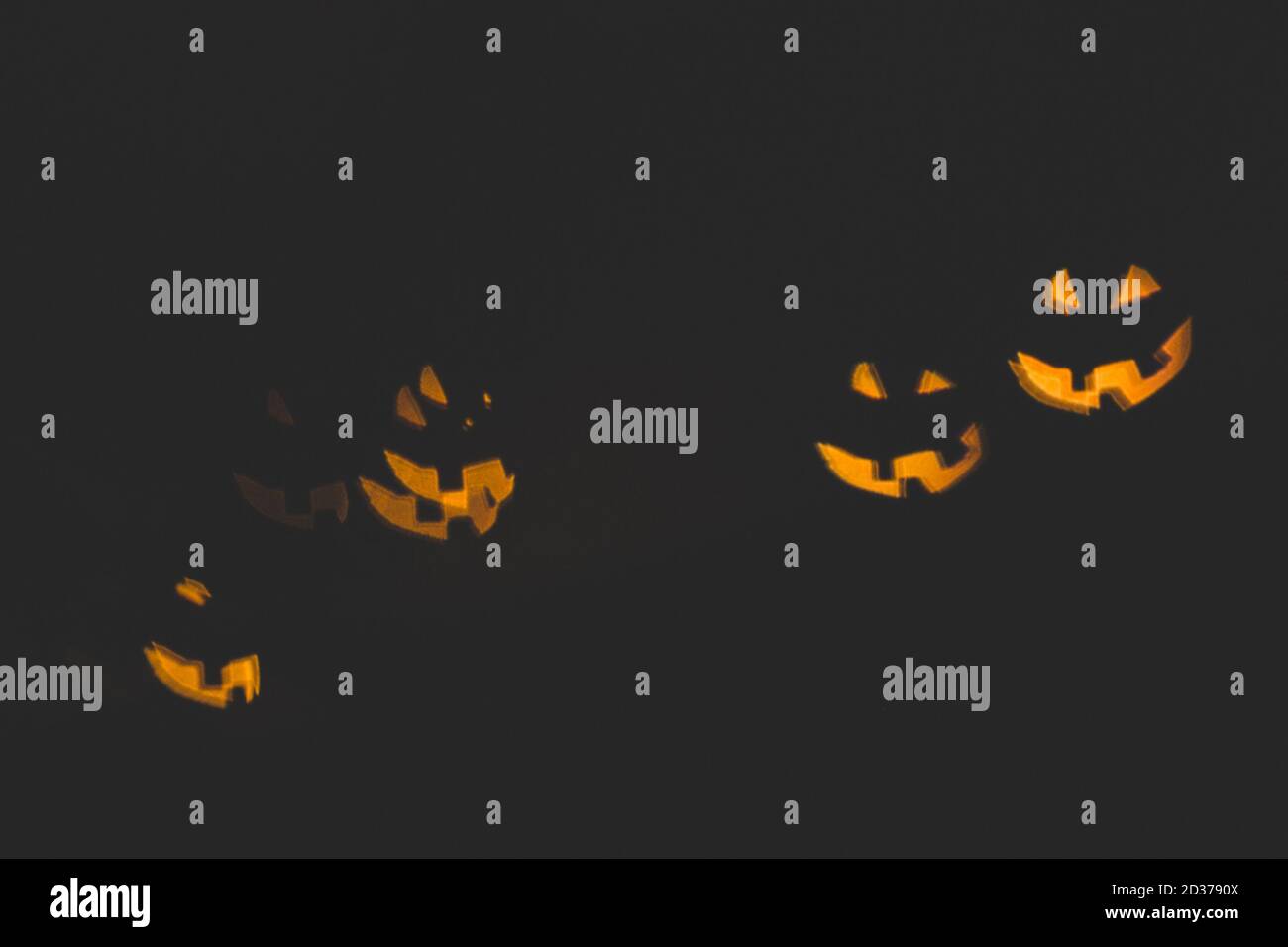 Rumore e sfondo astratto sfocato con la zucca volti bokeh luce Foto Stock