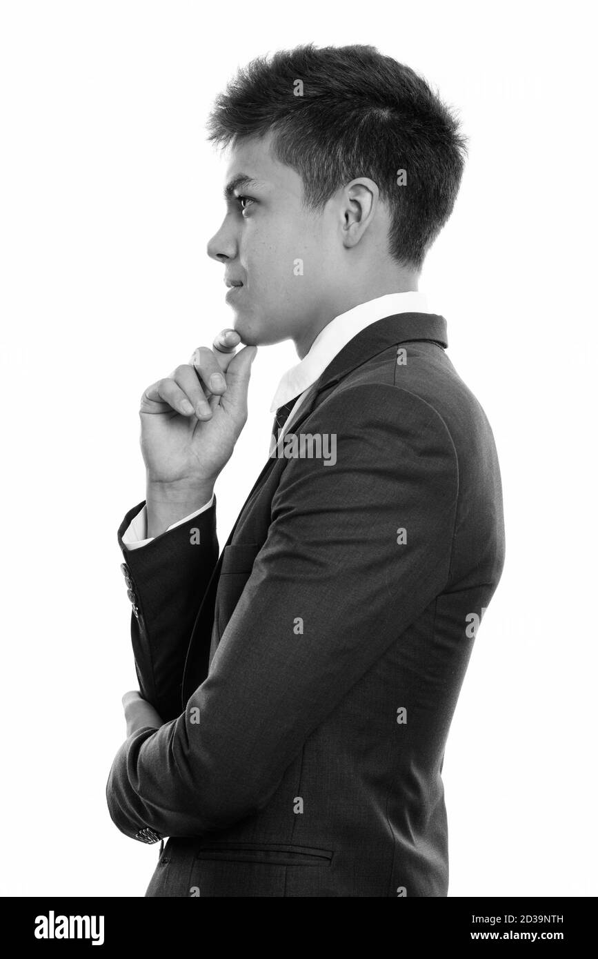 Vista di profilo del giovane imprenditore bello pensare Foto Stock