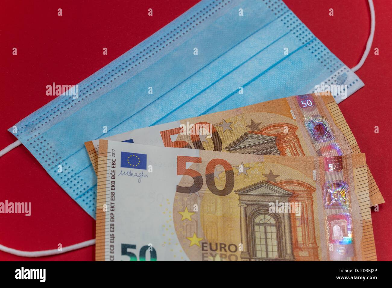 Respiratore e banconote, denaro di cautela Foto Stock