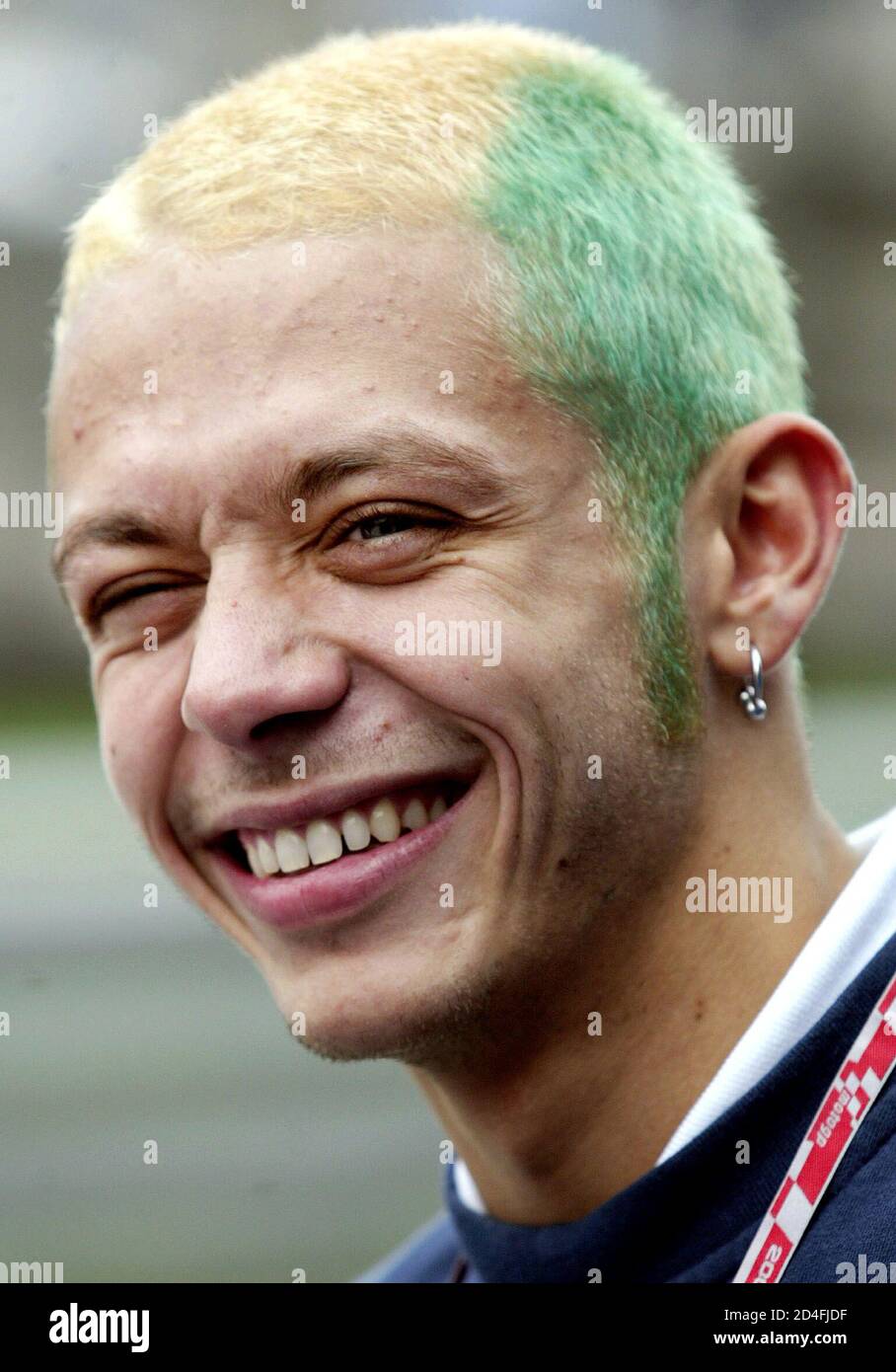 Italian Moto GP rider Valentino Rossi smiles before a news conference for  the Rio Grand Prix, at the Nelson Piquet circuit in Rio de Janeiro,  September 17, 2003. Rossi colored his hair
